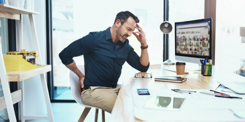 Fysieke belasting rugpijn werk ergonomie tips personeel kantoor